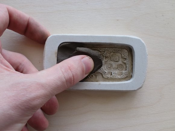 Fill the mould with clay